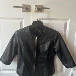 Real Leather jacket. Never worn in size M but can fit Small. Sleeves are 15 in